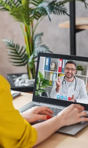 A patient in a video call with her doctor
