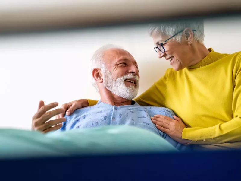 An older couple with a clinician during a consultation